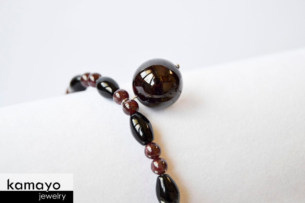 CAPRICORN BRACELET - Red Garnet Pendant and Black Onyx Beads
